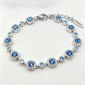 Ocean Blue Crystal Halo Link Bracelet in Polished Silver Finish