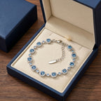 Ocean Blue Crystal Halo Link Bracelet in Polished Silver Finish